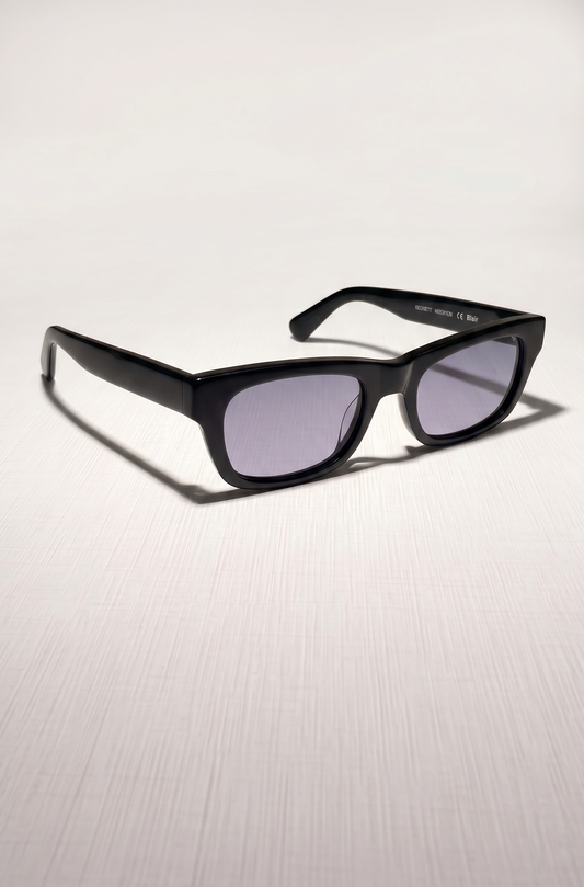 Black sunglasses with a reflective surface on a light gray background